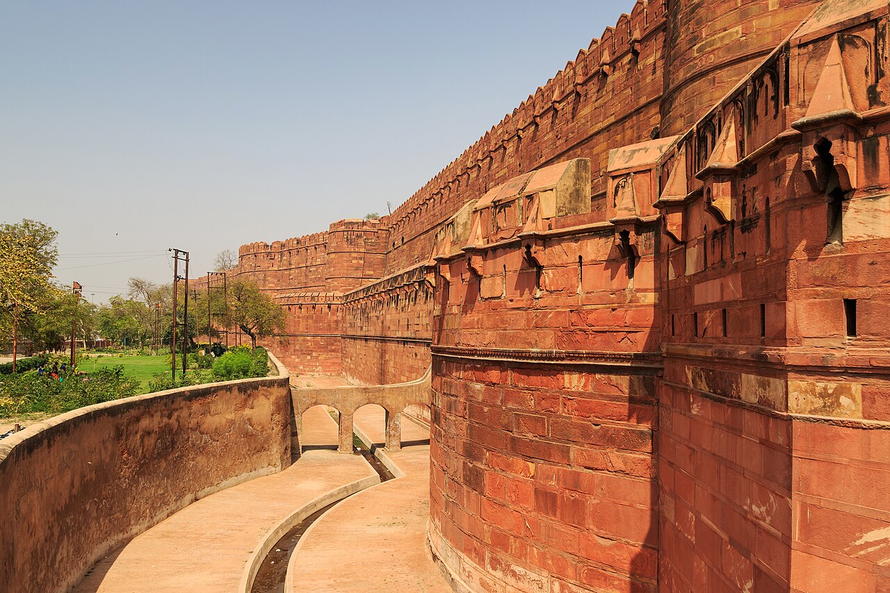 Massive red sandstone ramparts and imperial palaces of Agra Fort