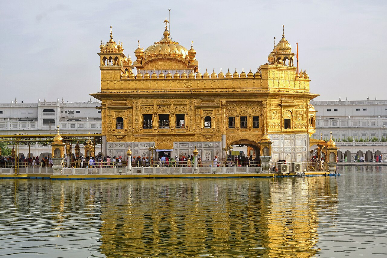 Harmandir Sahib Golden Temple shimmering above the sacred Amrit Sarovar pool in Amritsar