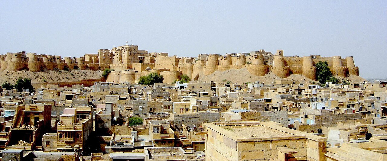 Golden yellow sandstone living fort of Jaisalmer rising above the Thar Desert