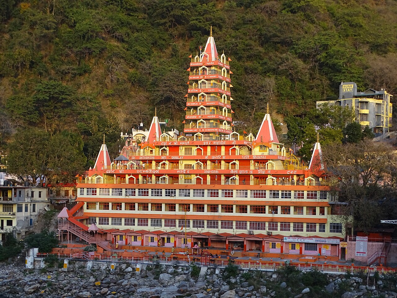 Emerald river Ganges flowing through the Himalayan foothills at Rishikesh