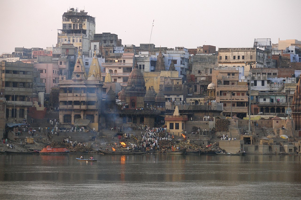 Ancient ghats and spiritual temples along the river Ganges at sunrise in Varanasi