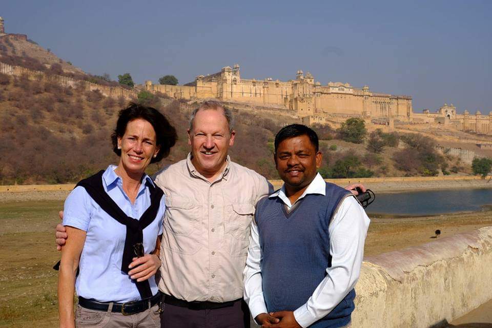 Foreign tourists at Amber Fort on a same day Jaipur tour with driver