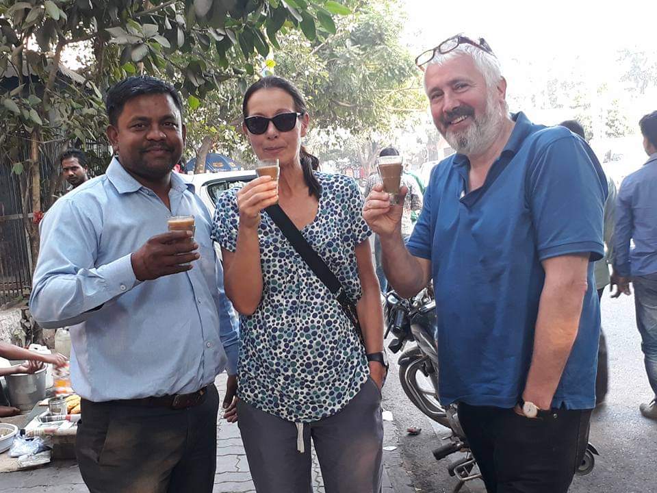 Guests with their driver on a Delhi local sightseeing tour by cab in Old Delhi