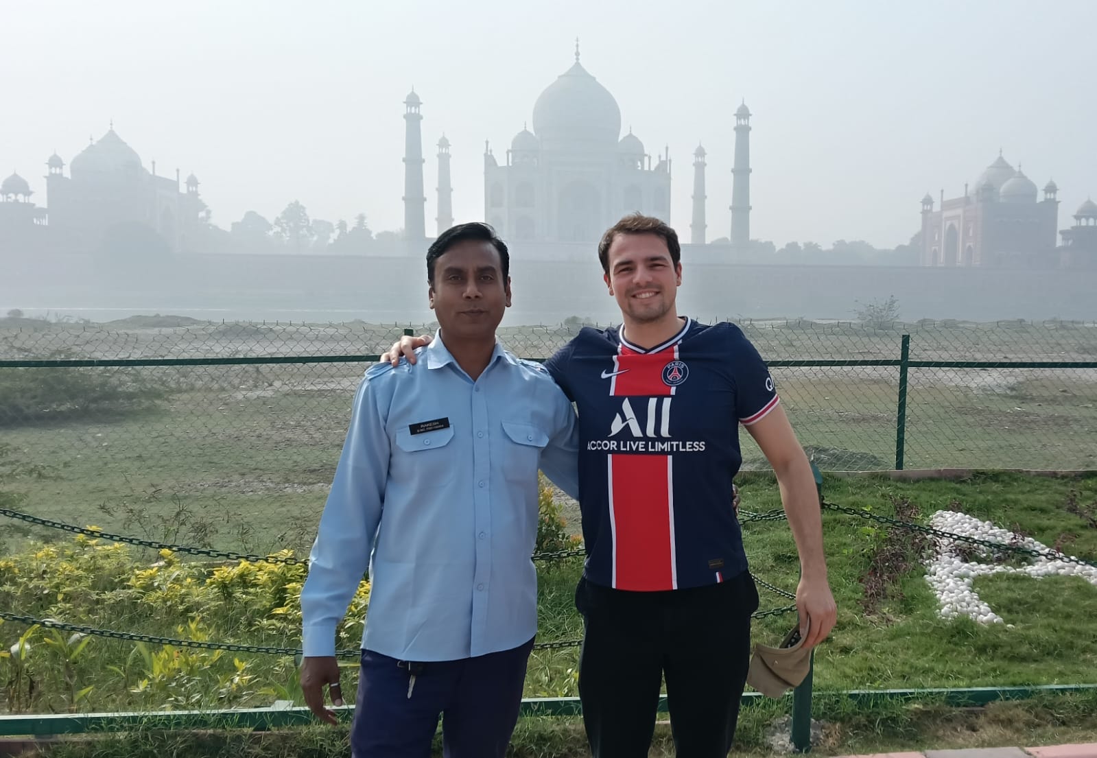 International traveler at the Taj Mahal with private driver India